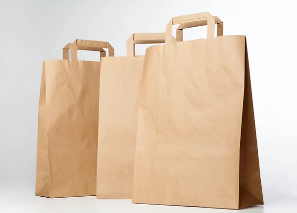 Beige shopping bags. — Stock Photo, Image