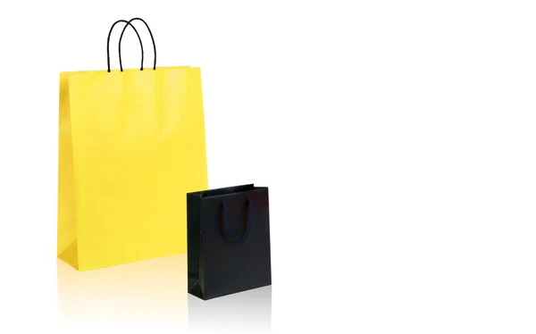 Siyah ve sarı alışveriş torbaları ile yer senin metin veya logo için — Stok fotoğraf