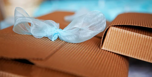 Box with blue bow — Stock Photo, Image