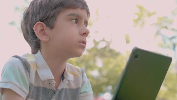 Close Child Tablet Sitting Grass Outdoors — Vídeo de Stock