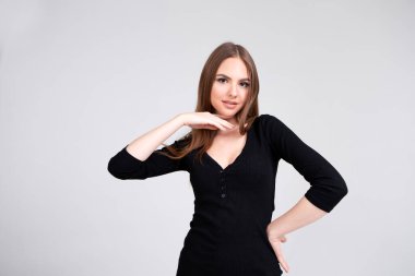 Stylish portrait of a beautiful girl with clean skin. Model appearance. Makeup and cosmetology