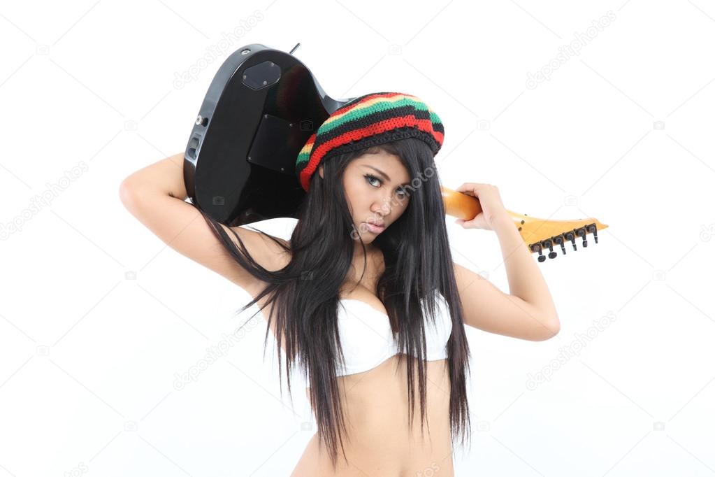 Woman and guitar with rastafarian style hat