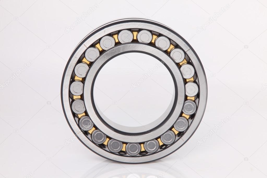 Composition of steel ball roller bearings in closeup on white background