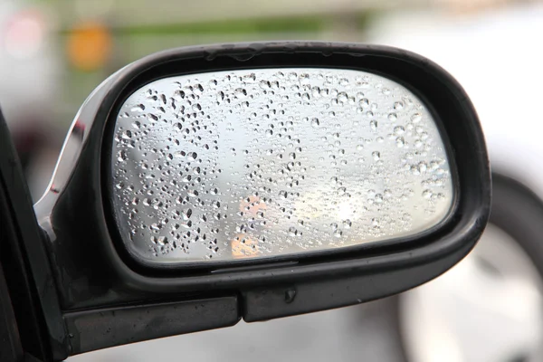 Rain on a car mirror — Stock Photo, Image