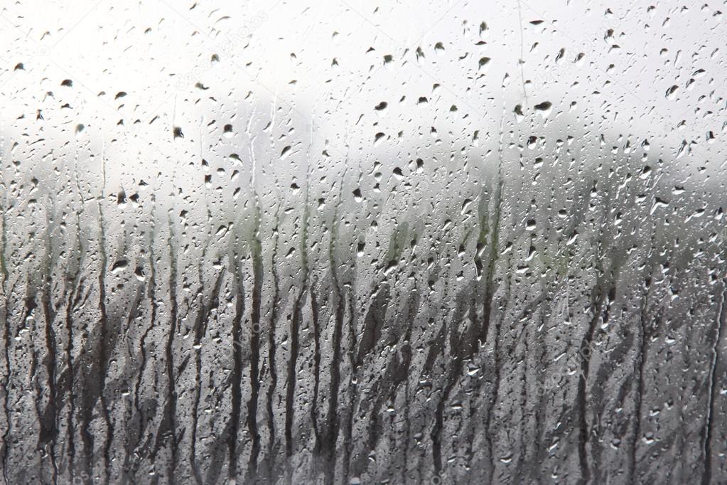 Drops of rain on the window (glass)