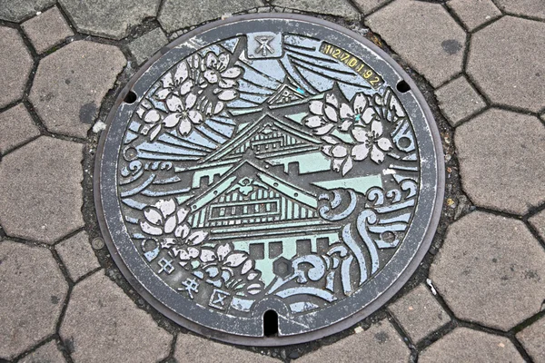 Couvercle de trou d'homme, Osaka Japon — Photo