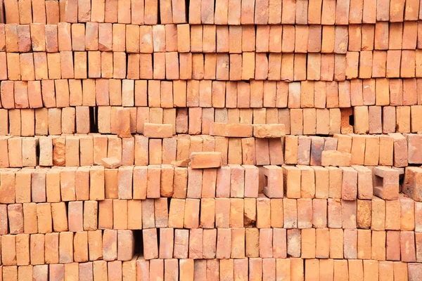 Muur of stapel van rode baksteen — Stockfoto