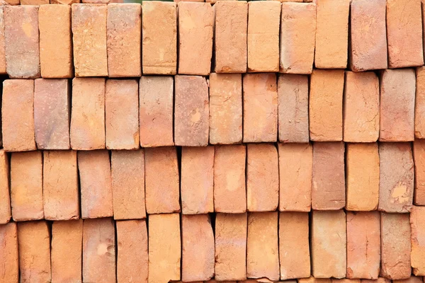 Muur of stapel van rode baksteen — Stockfoto