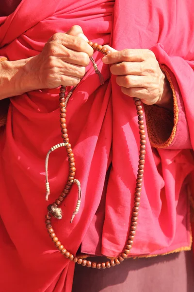 Hands holding rosary — Stock Photo, Image