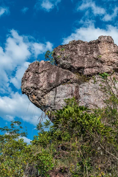 Sedimentary rock formation in the middle of the forest with blue sky in Chapada Diamantina, Bahia state, Brazil