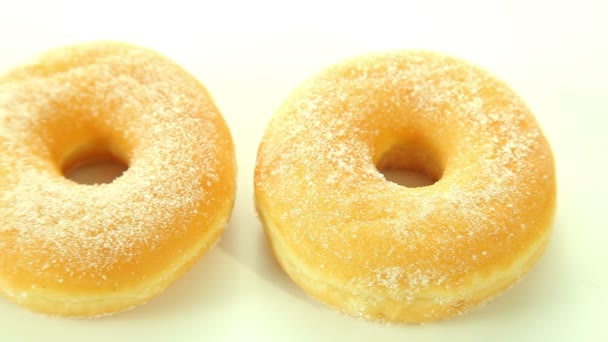 Donuts op witte achtergrond — Stockvideo