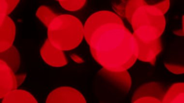 Kırmızı defokus ışıkları, soyut kırmızı hareket arka planlar, bulanık ışık bokeh etkisi