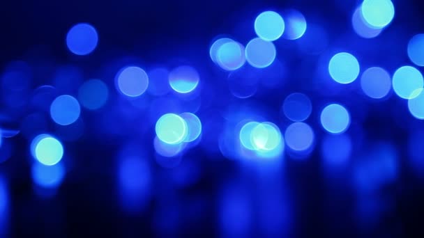 Abstract blue background with defocused lights, blurred light motion bokeh effect — Stock Video