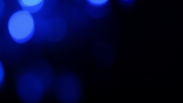 Abstract blue background with defocused lights, blurred light motion bokeh effect — Stock Video