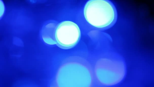 Abstrakte blaue Hintergrund mit defokussierten Lichtern, verschwommenes Licht Bewegung Bokeh-Effekt — Stockvideo