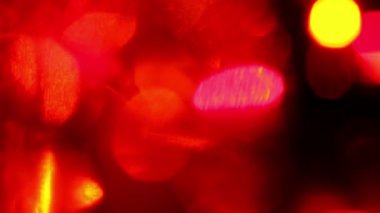 Kırmızı defokus ışıkları, soyut kırmızı hareket arka planlar, bulanık ışık bokeh etkisi