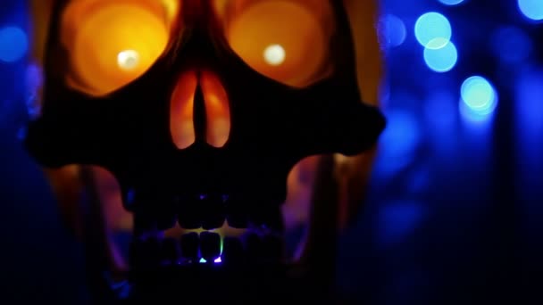 Skull and abstract blue background - defocused lights, blurred light effect — Stock Video