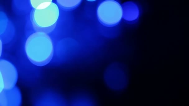 Intreepupil blauwe lichten met bokeh, wazig beweging achtergrond — Stockvideo