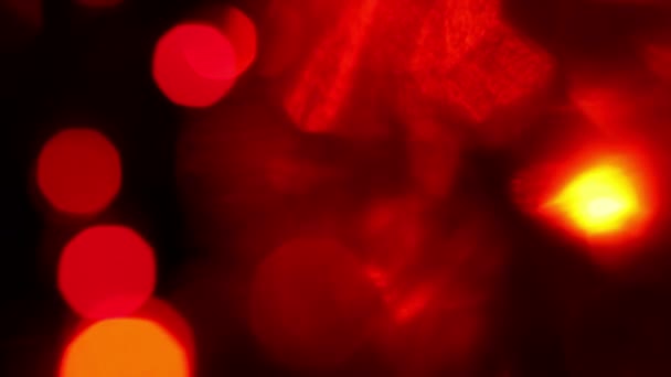 Θολή κόκκινο και πορτοκαλί φώτα με bokeh, φόντο defocused κίνηση — 图库视频影像