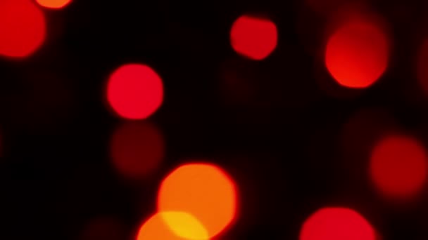 Verschwommene Rot und orange Leuchten mit Bokeh, Defokussiert Bewegung Hintergrund — Stockvideo