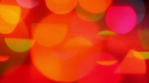 Borrosas luces rojas y naranjas con bokeh, fondo de movimiento — Vídeos de Stock