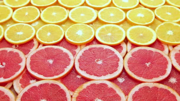 Sliced grapefruit with orange — Stock Video