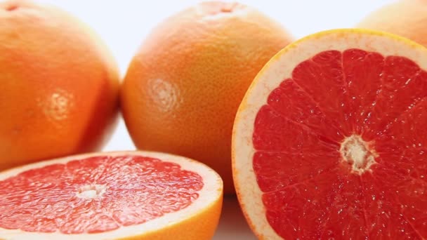 Röd grapefrukt frukter, rörelse bakgrunden — Stockvideo