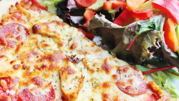 Pizza cheese with healthy nutritious salad