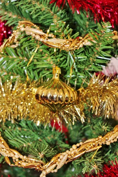 Christmas decorations for tree in gold glitter and red — Stock Photo, Image