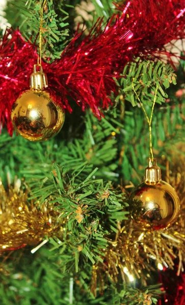 Christmas decorations for tree in gold glitter and red — Stock Photo, Image