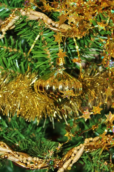 Christmas decorations for tree in gold glitter and red — Stock Photo, Image