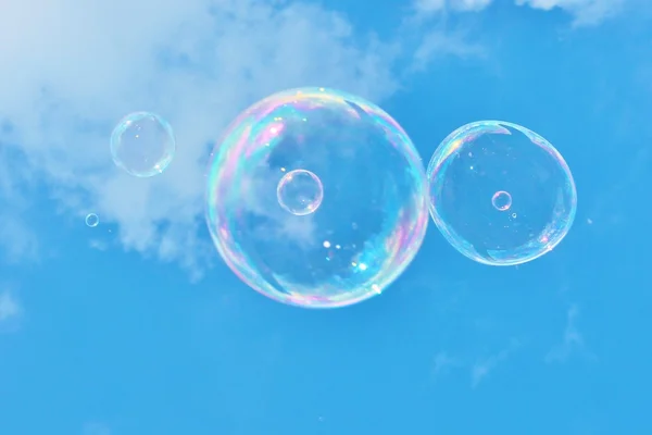 Soap bubbles on breeze in sky — Stock Photo, Image