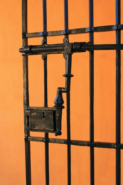 Orange wall with iron gate Spain — Stock Photo, Image