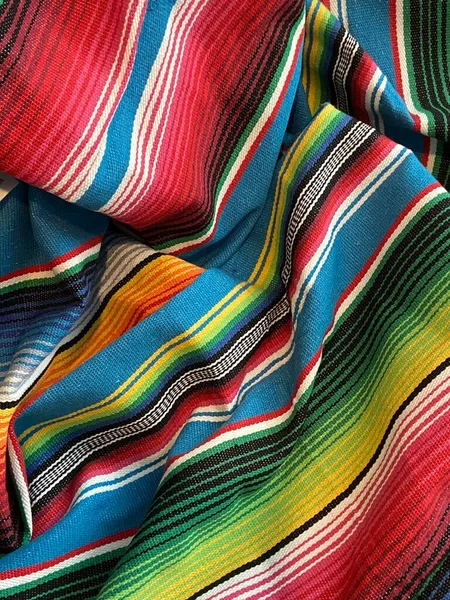 poncho serape Mexican background for Mexico cinco de mayo fiesta wooden copy space stripe pattern minimalist simple Mexican background backdrop - stock photo,