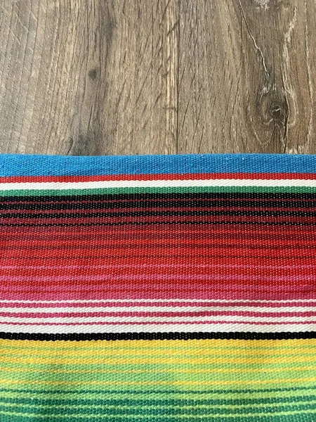 poncho serape Mexican background for Mexico cinco de mayo fiesta wooden copy space stripe pattern minimalist simple Mexican background backdrop - stock photo,