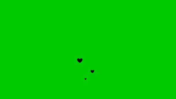 アニメーション化された黒い心は下から上へ飛ぶ 愛の概念 緑の背景に孤立した心の泉 — ストック動画