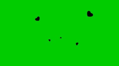 Siyah kalplerle dolu animasyon arka plan merkezden uçuyor. Aşk kavramı. Yeşil arkaplanda izole edilmiş kalpler.