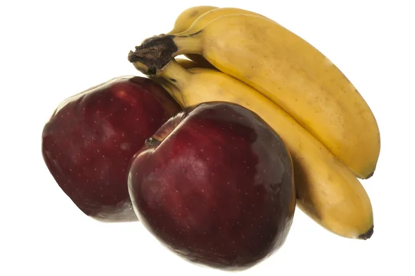 Бананы и красные яблоки — стоковое фото