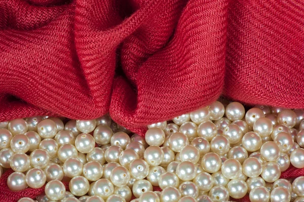 Pearls on a colored background fabric — Zdjęcie stockowe