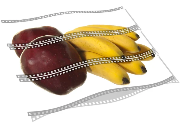 Пленка с детскими бананами и красными яблоками — стоковое фото