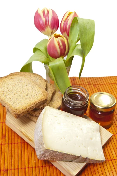 Cheese, honey and tulip — Stock Photo, Image