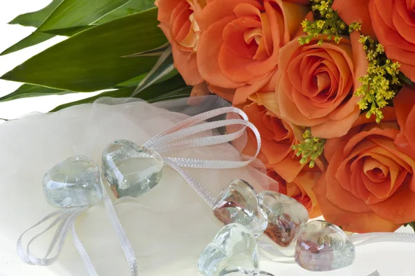 Crystal heart and orange rose — Stock Photo, Image