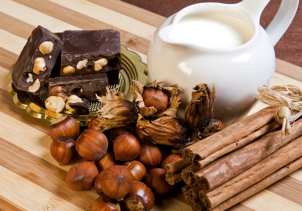 Chocolat nougat, nuts, milk and cinnamon — Stock Photo, Image