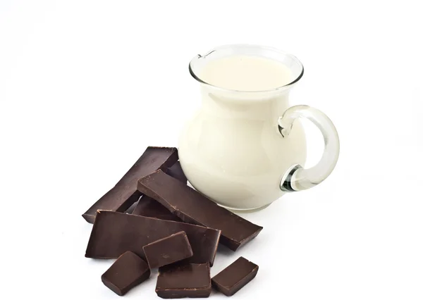 Dark chocolate and milk jug — Stock Photo, Image