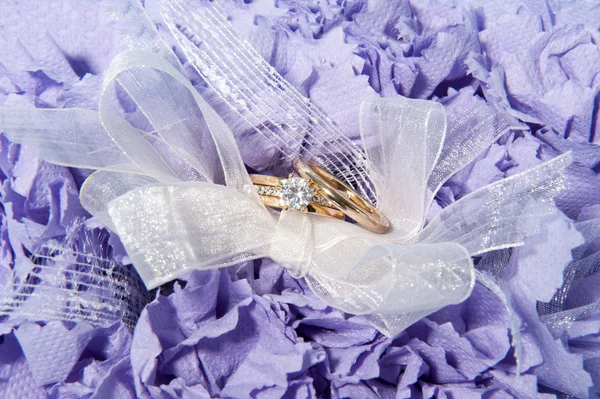 Wedding rings and accessories on paper — Stock Photo, Image