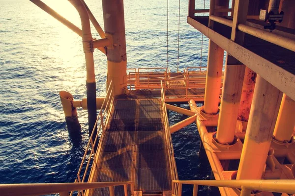 Walkway offshore Industry oil and gas production petroleum pipeline.