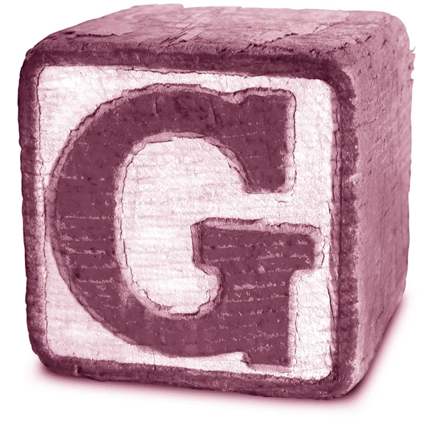 Fotografie purpurové dřevěných tiskací písmeno g — Stock fotografie