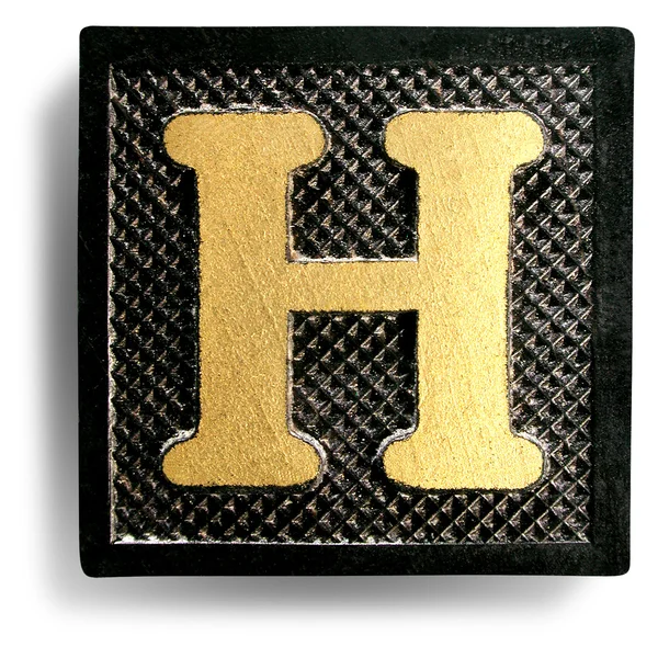 Фото буквы H игровой плитки — стоковое фото