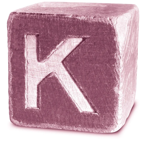 Фото Magenta Wooden Block Letter K — стоковое фото