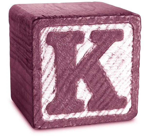 Фото Magenta Wooden Block Letter K — стоковое фото